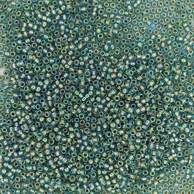 0995 - 10g Size 11/0 Toho seed beads in Gold lined Rainbow Aqua