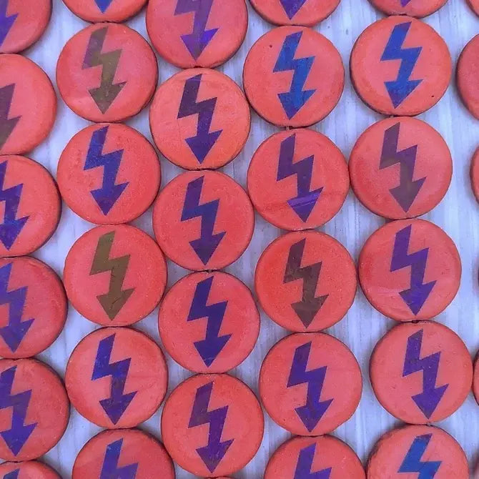 8 x 16mm discs in Matt Orange with laser etched dark High Voltage design