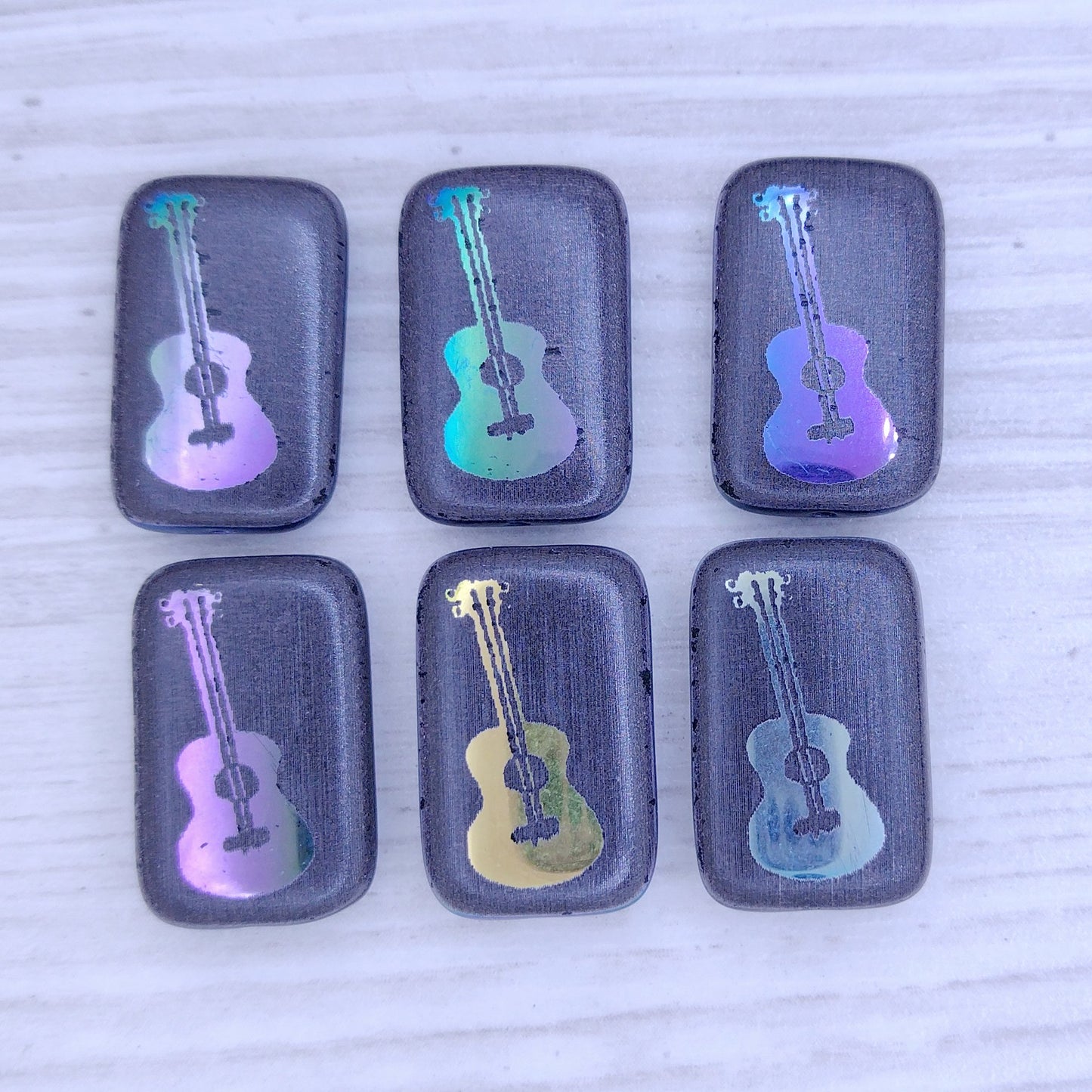 4 x Rectangular beads in Black with guitar design (18x12mm)