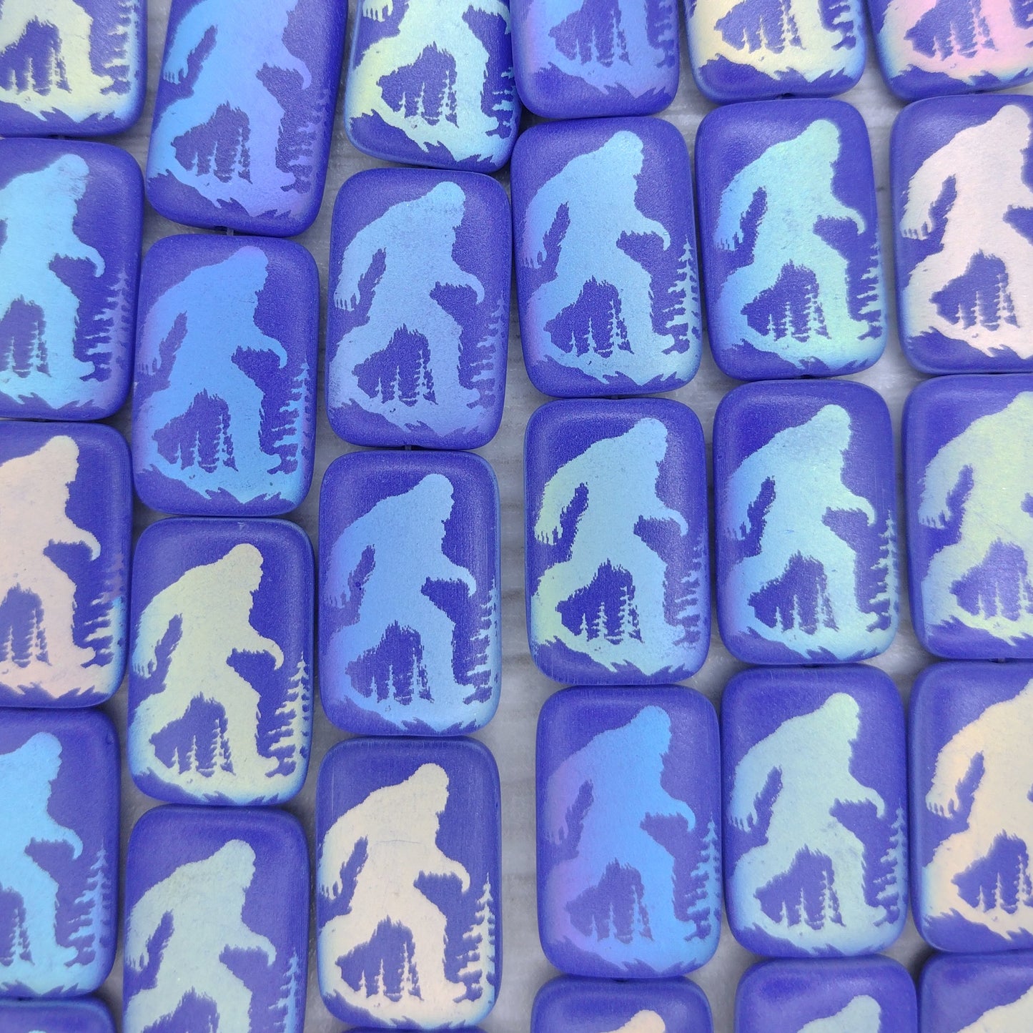 6 x Rectangular beads in Matt Dark Blue with Big Foot design (18x12mm)