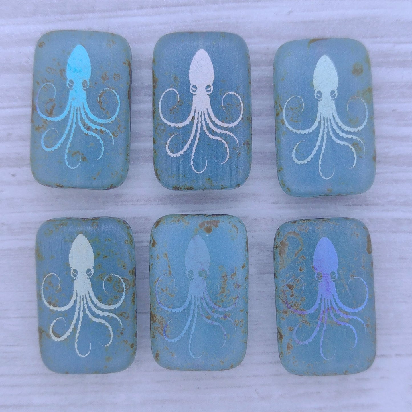 4 x rectangular beads in Matt Transparent Aqua Picasso with laser etched Octopus (18x12mm)