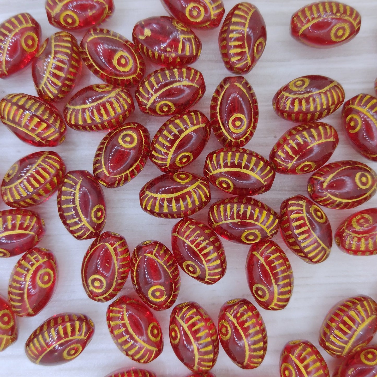 8 x oval Eye beads in Siam Red with Gold (13x9mm)