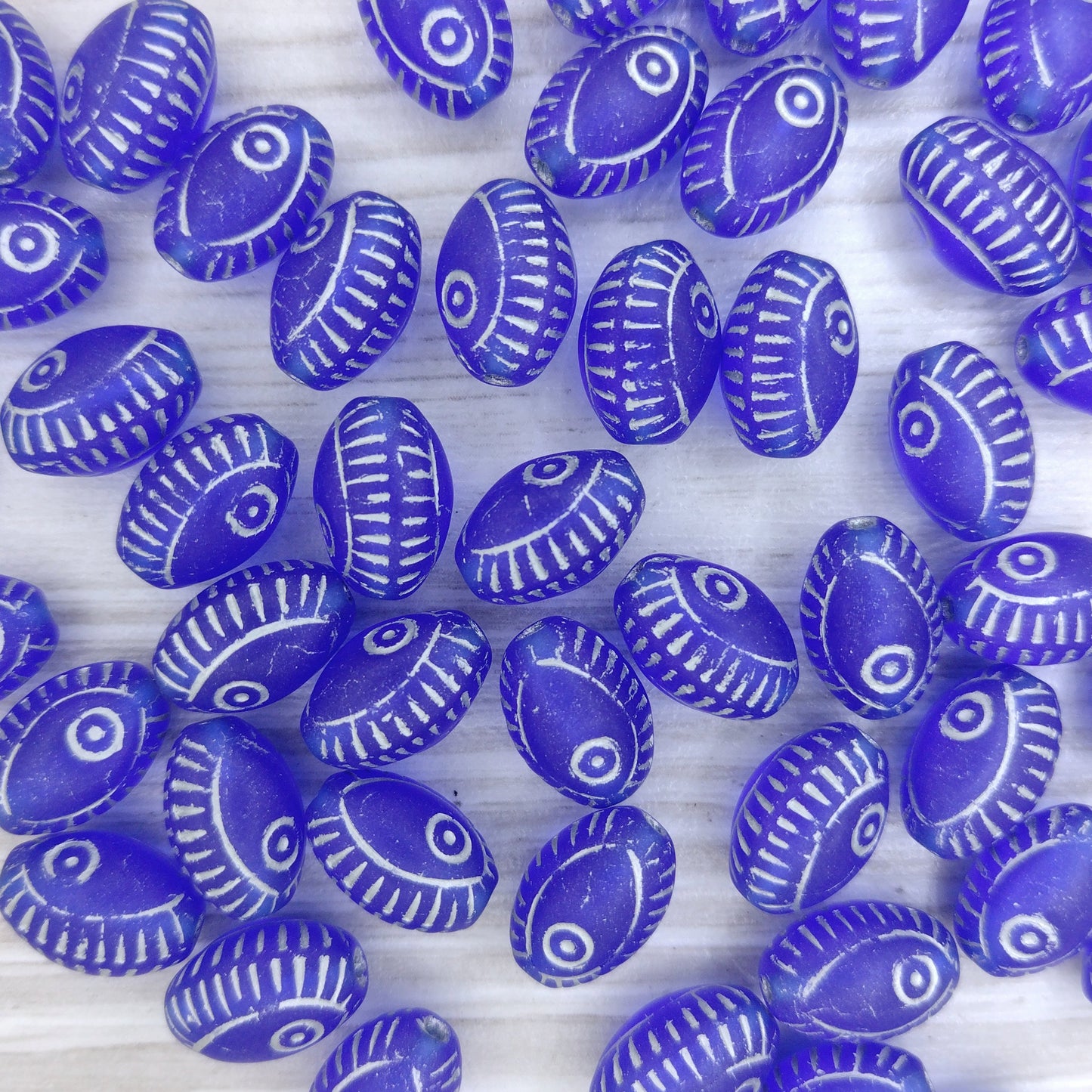 8 x oval Eye beads in Matt Sapphire with Silver (13x9mm)