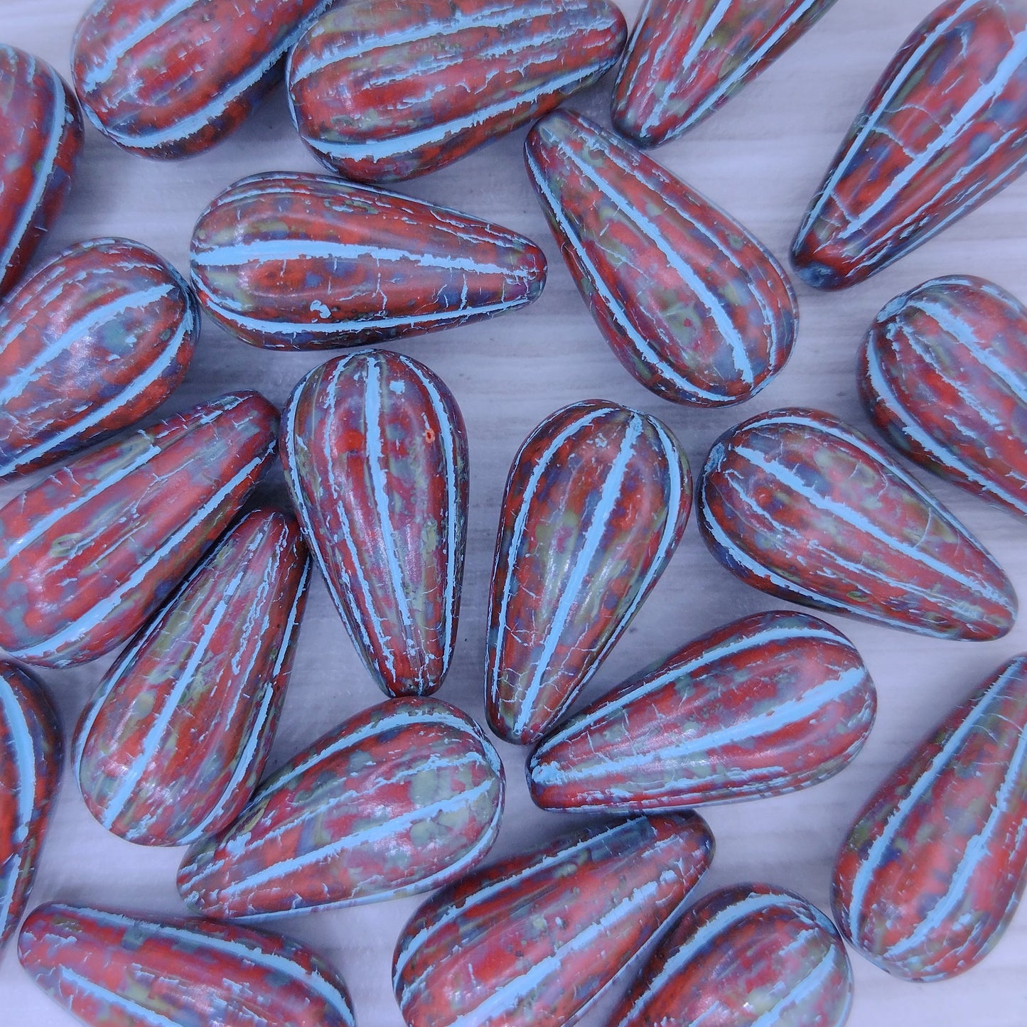 Pair of Melon drops in Opaque Coral with Turquoise (22x11mm)