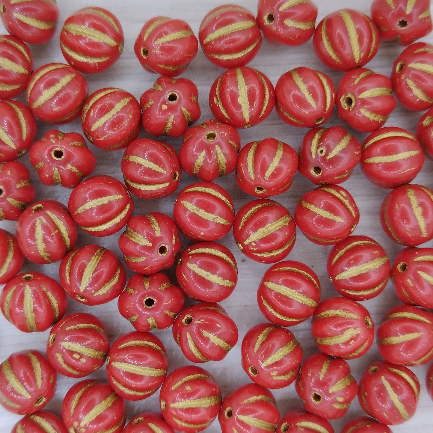 10 x 8mm melon beads in Coral with Gold