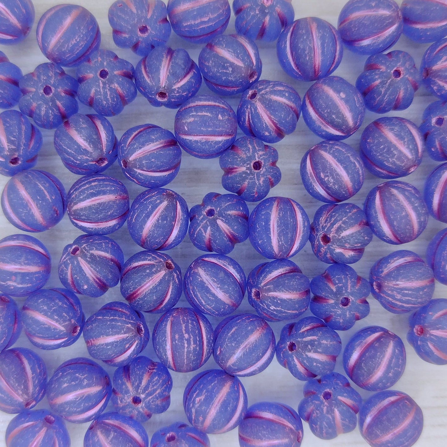 10 x 8mm melon beads in Matt Sapphire with Pink Lustre