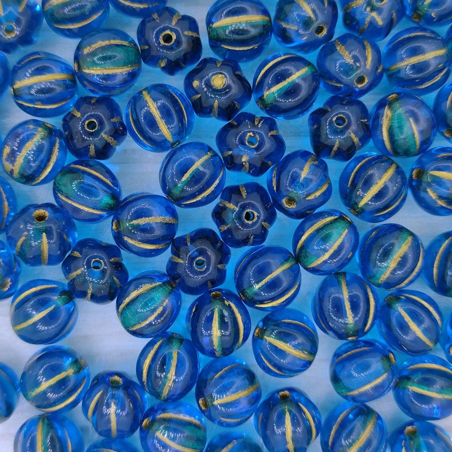 10 x 8mm melon beads in Dark Aqua with Gold
