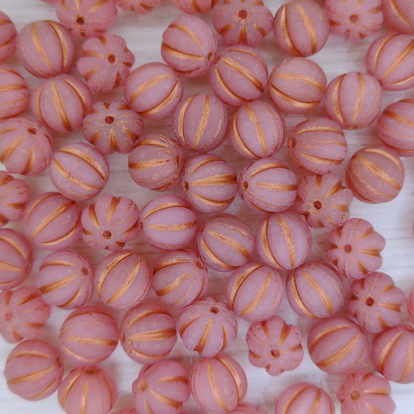 10 x 8mm melon beads in Matt Opal Pink with Copper