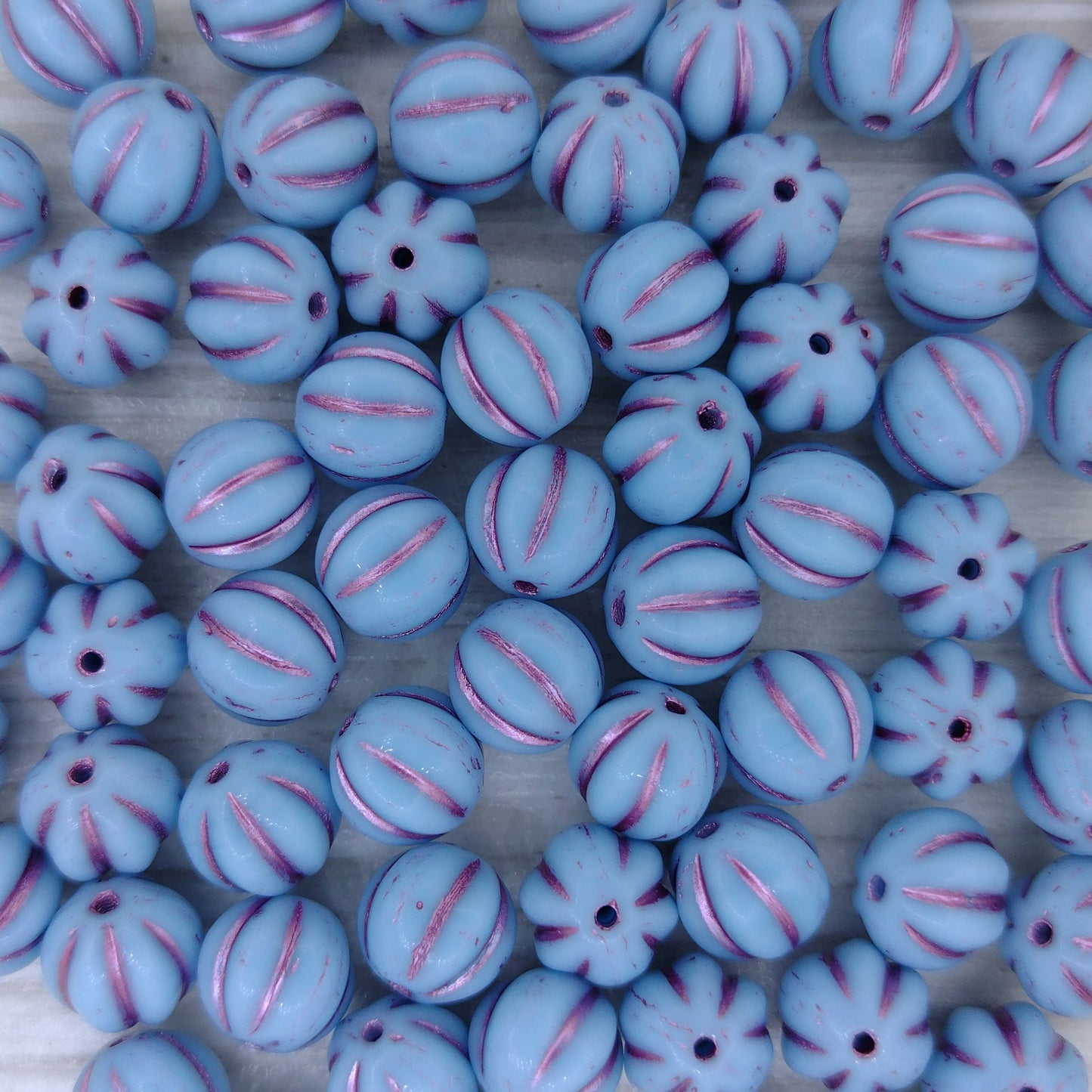 10 x 8mm melon beads in Turquoise with Pink Lustre