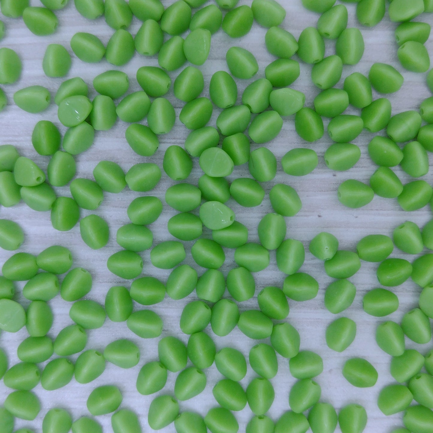 50 x pinch beads in Opaque Light Green (3x5mm)