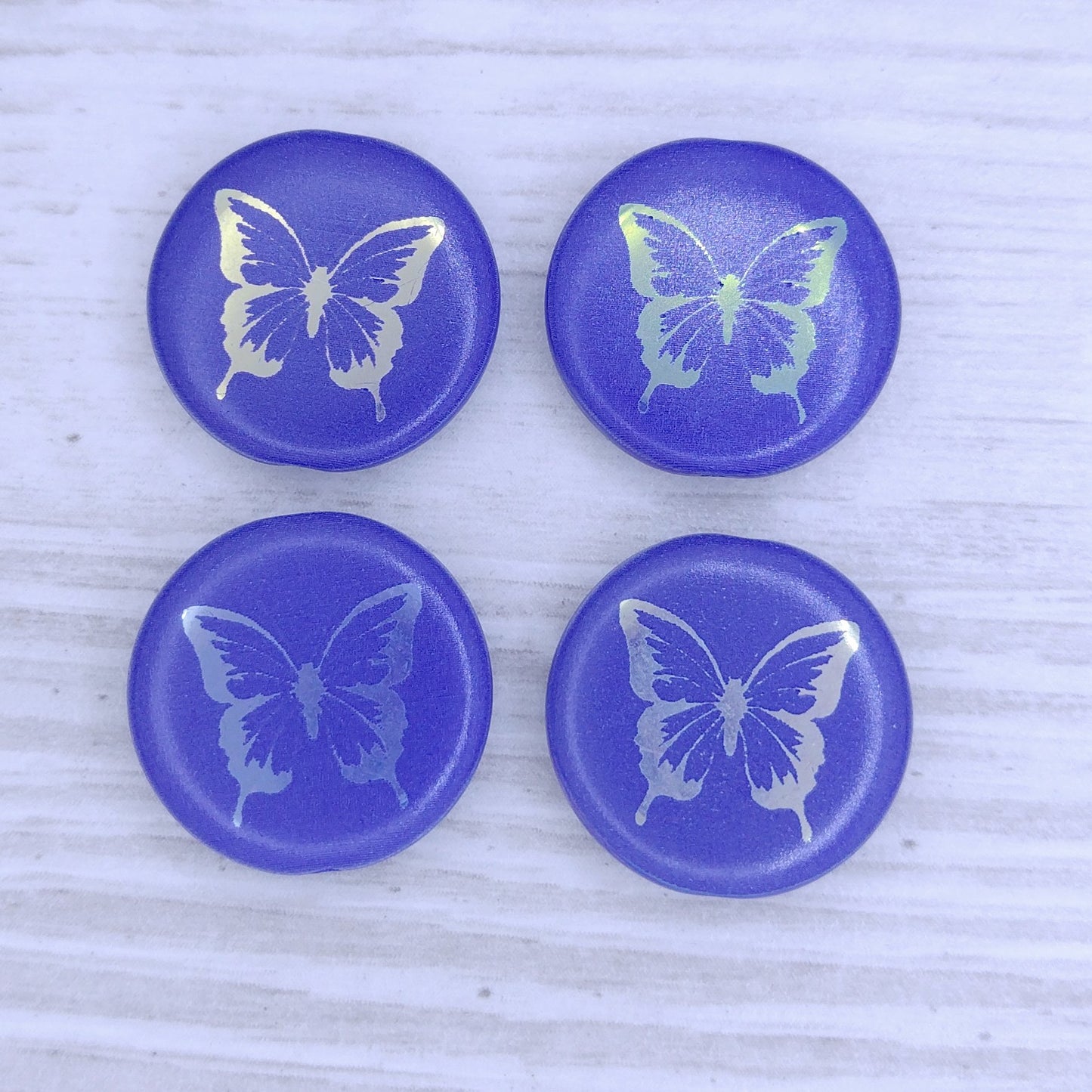 4 x 17mm disc beads in Dark Blue with laser etched Butterfly