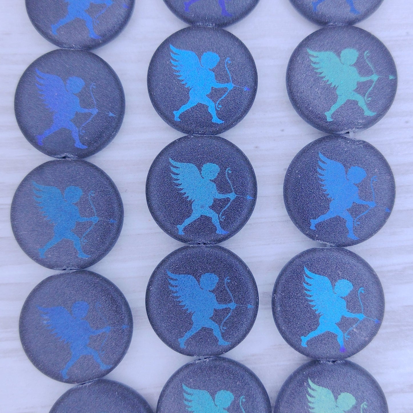 8 x 17mm disc beads in Matt Black with Cupid