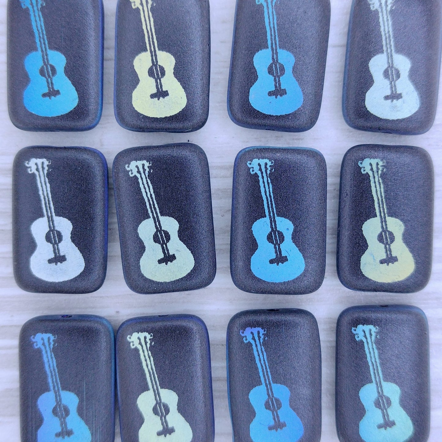 4 x Rectangular beads in Matt Black with guitar design (18x12mm)