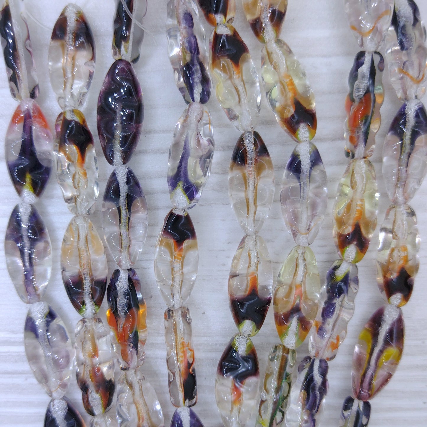 6 x Spindle beads in Crystal and Browns mix (18x8mm)