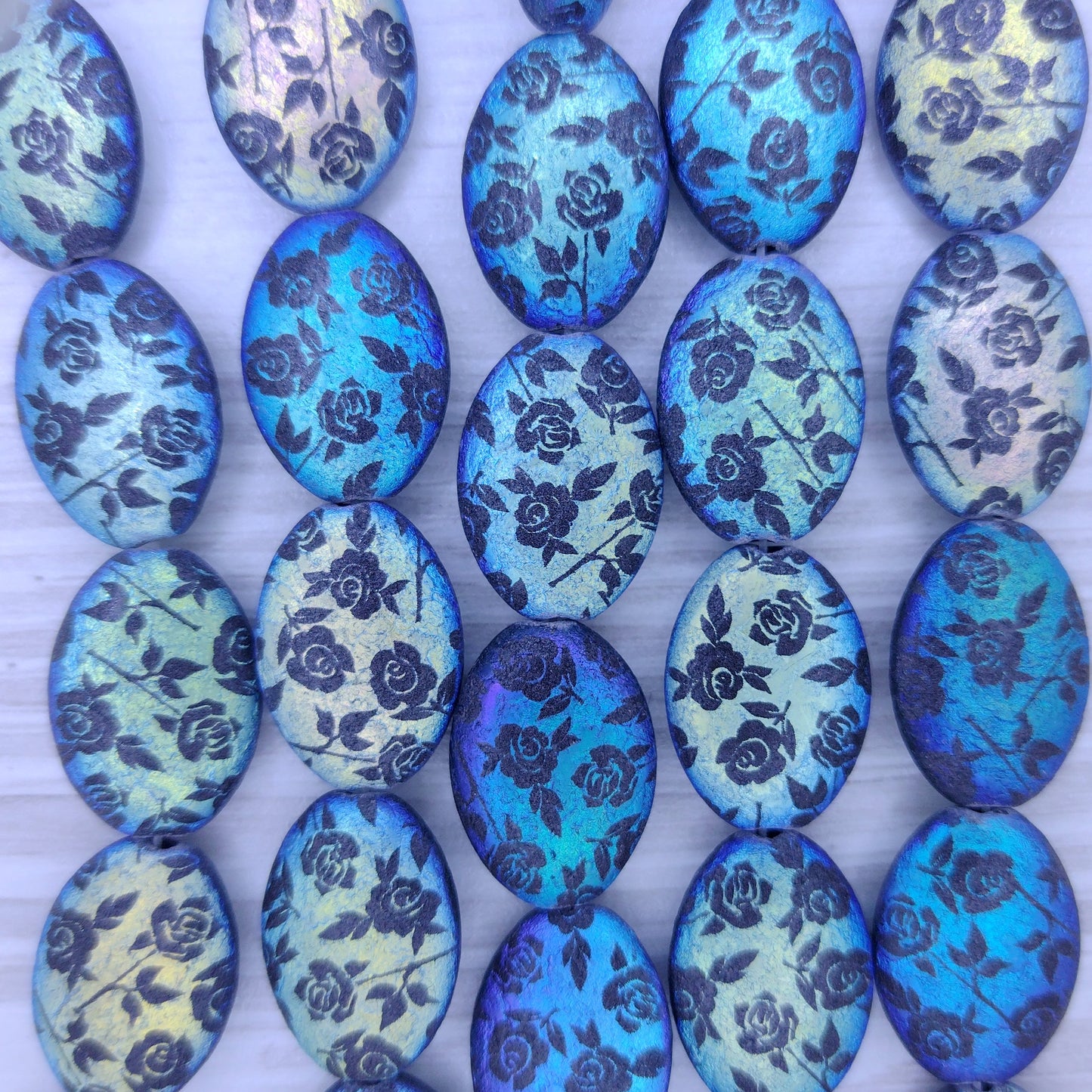 6 x 18x13mm puffed oval beads in etched Black with laser etched Flowers