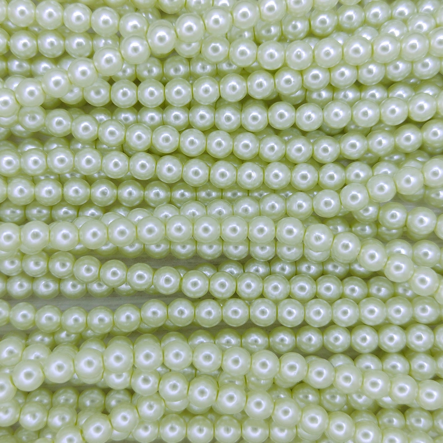 120 x 4mm round pearls in Light Yellow Green