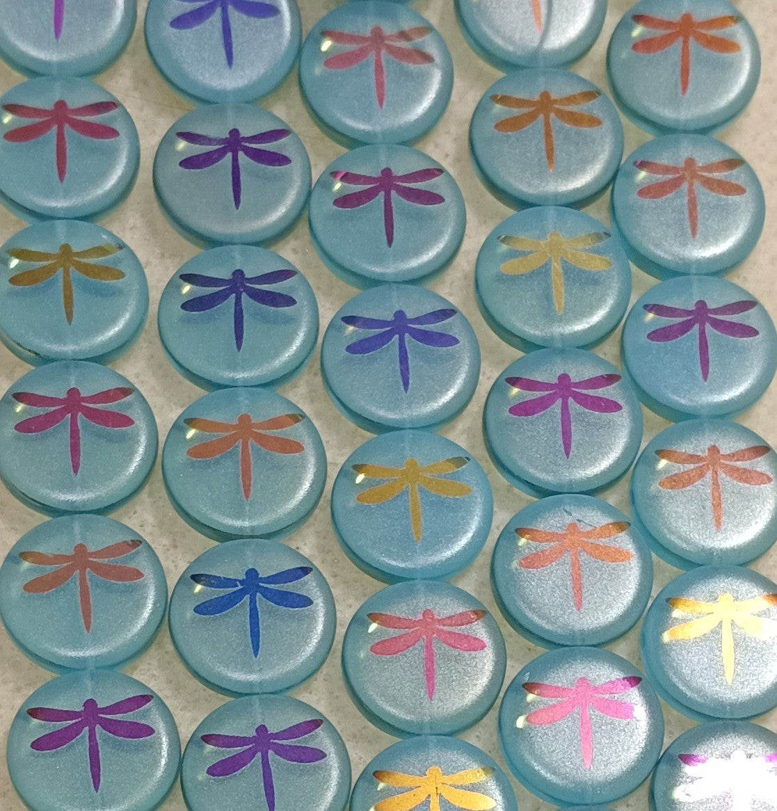 8 x 16mm discs in Aqua Opal with laser etched dragonflies