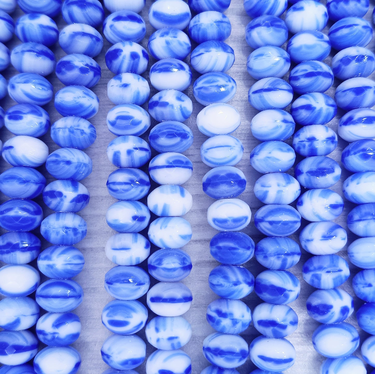 25 x faceted rondelles in Blue and White Marble (6x9mm)