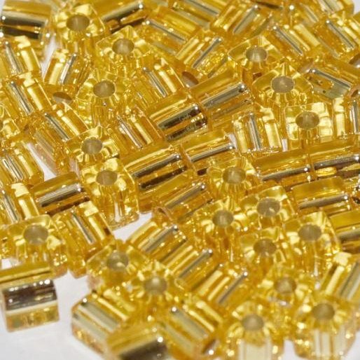 0003 - 10g Miyuki 4mm cubes in Silver lined Gold