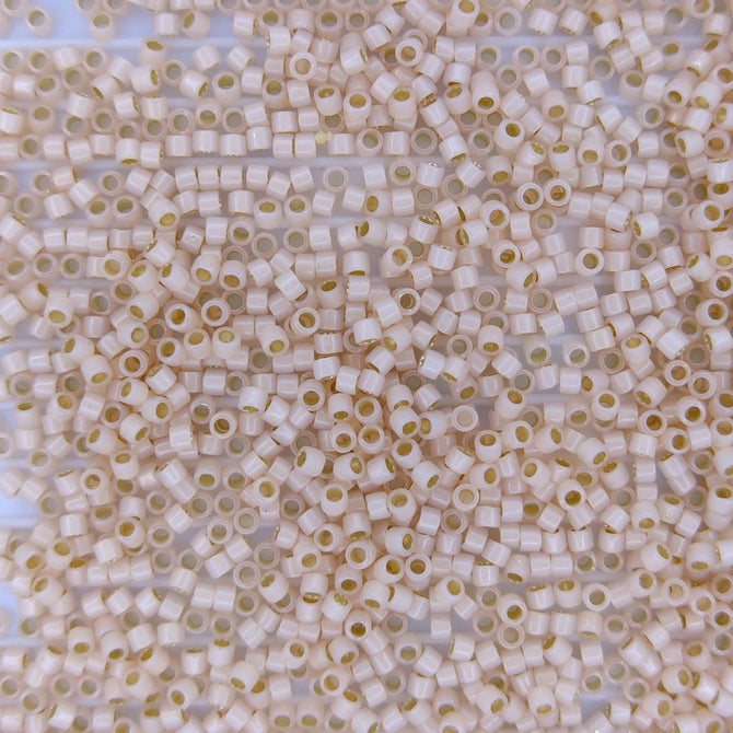 DB1452 - 5g Size 11/0 delicas in Silver lined Pale Peach Opal