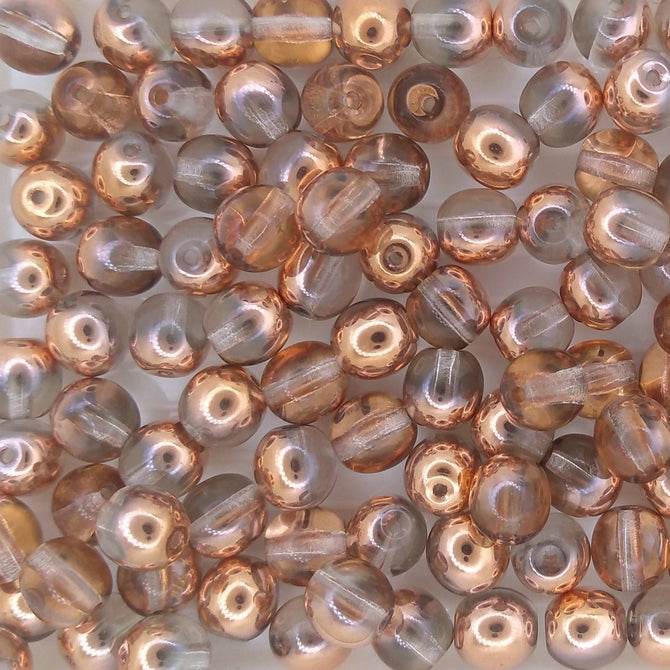 25 x 6mm round beads in Crystal/Capri Gold