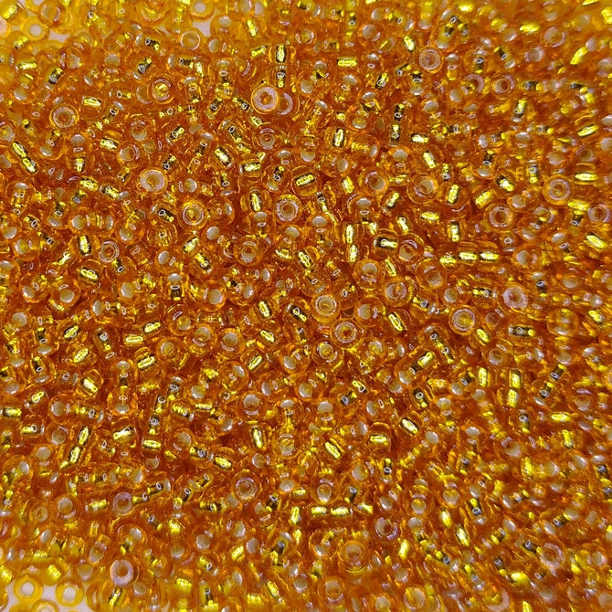 4261 - 10g Size 11/0 Miyuki seed beads in Duracoat Silver lined Amber Gold