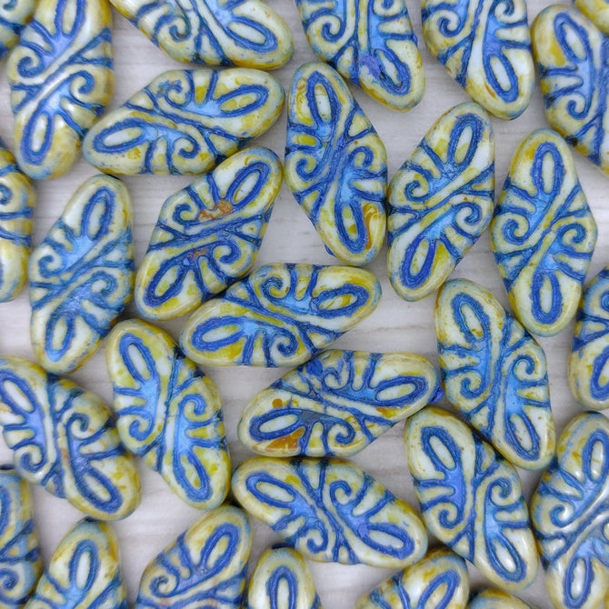 4 x Arabesque beads in Alabaster Picasso/Blue (19x9mm)