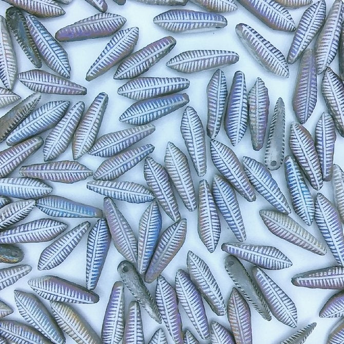 15 x White daggers with raised Feather design (5x14mm)