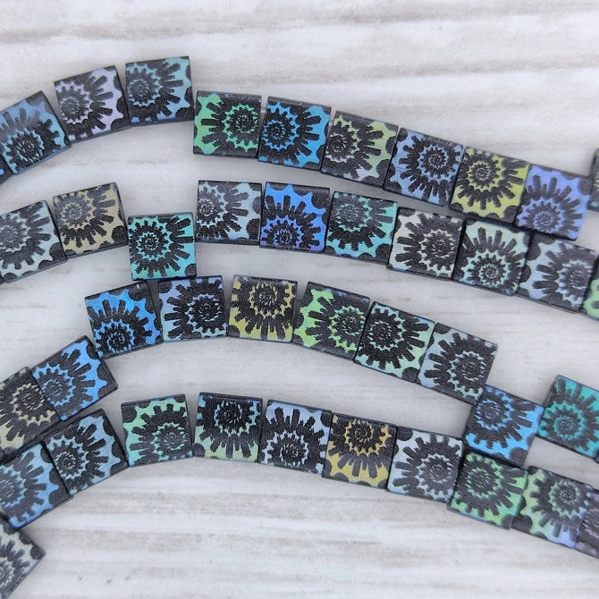 25 x Tila beads in Matt Black with Shell design