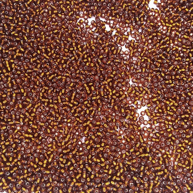 0005 - 10g Size 11/0 Miyuki seed beads in Silver lined Dark Topaz