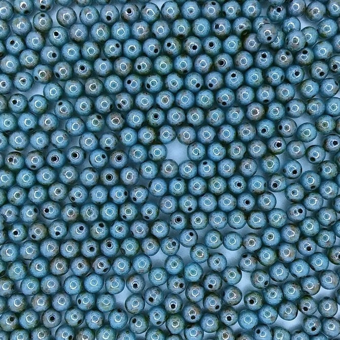 50 x 4mm round beads in Alabaser/Blue Lustre