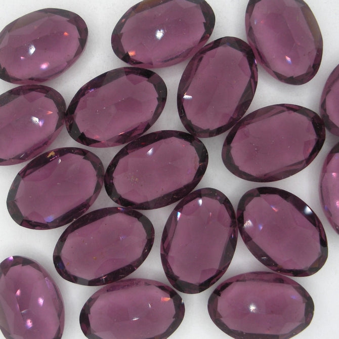 Cab70 - 11x16mm oval cabochon in Amethyst (Vintage)