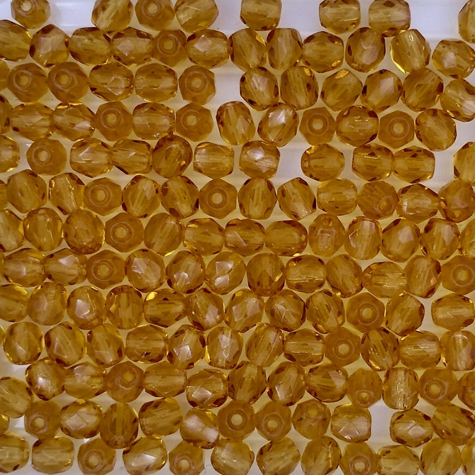 50 x 4mm faceted beads in Topaz