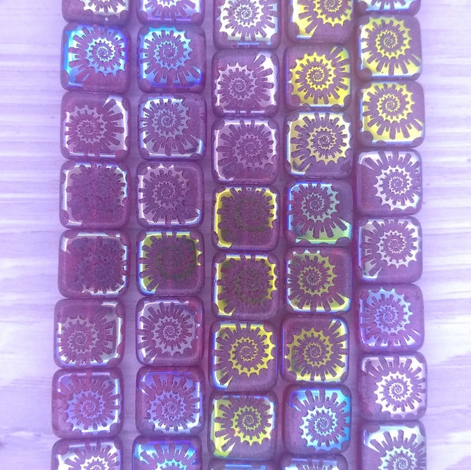 12 x 10mm beads in Raspberry with laser etched Shell