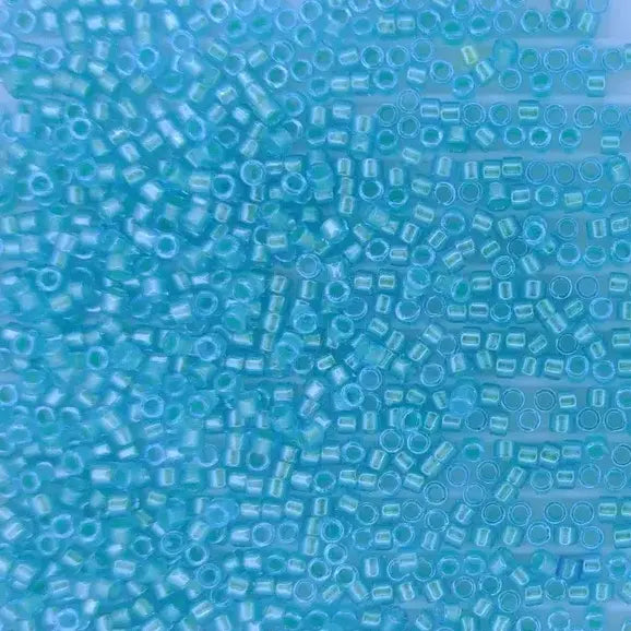 DB1708 - 25g Size 11/0 delicas in Mint Pearl lined Ocean Blue