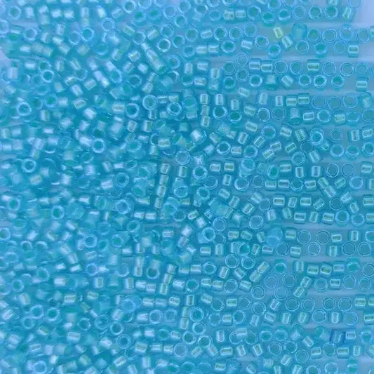 DB1708 - 25g Size 11/0 delicas in Mint Pearl lined Ocean Blue