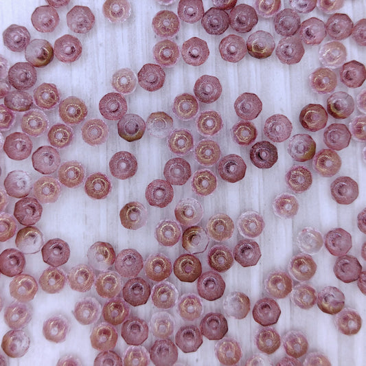 25 x faceted rondelles in Transparent Pink Lustre (2x3mm)