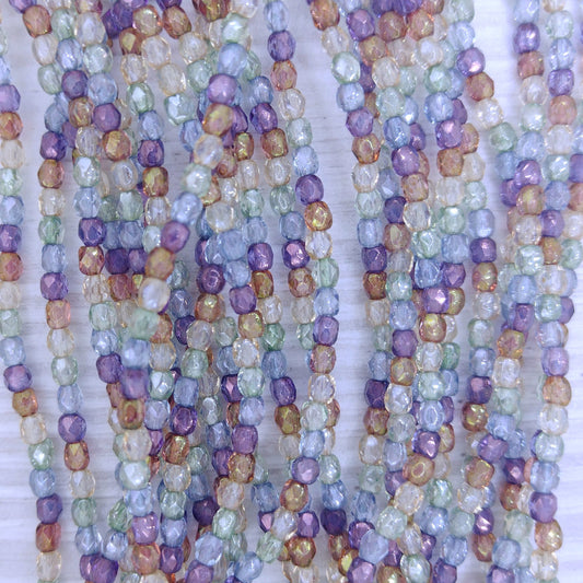 50 x 3mm faceted beads in Crystal Picasso Lustre