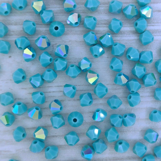 24 x 4mm bicones in Turquoise AB (Preciosa)