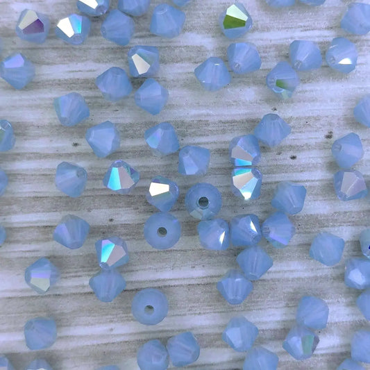 24 x 4mm bicones in Light Sapphire Opal AB (Preciosa)