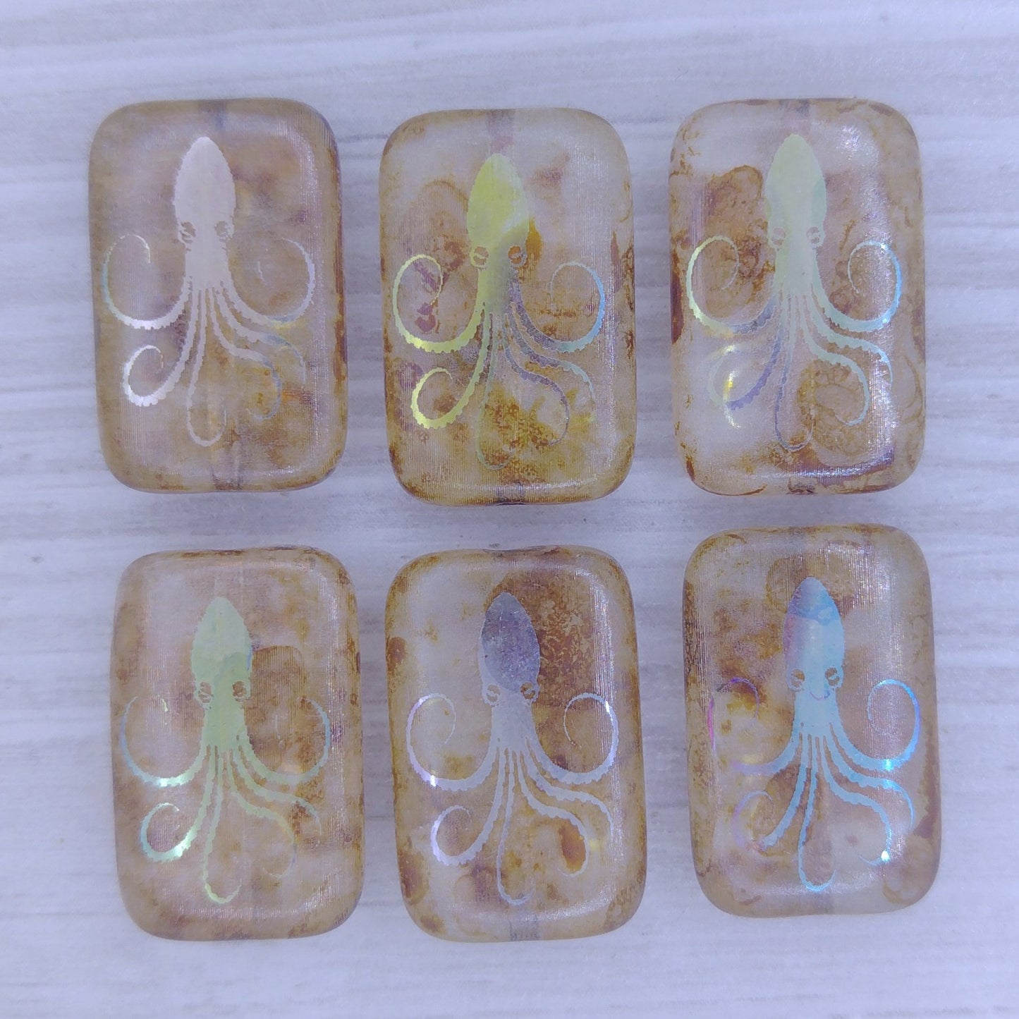 4 x rectangular beads in Crystal Picasso with laser etched Octopus (18x12mm)