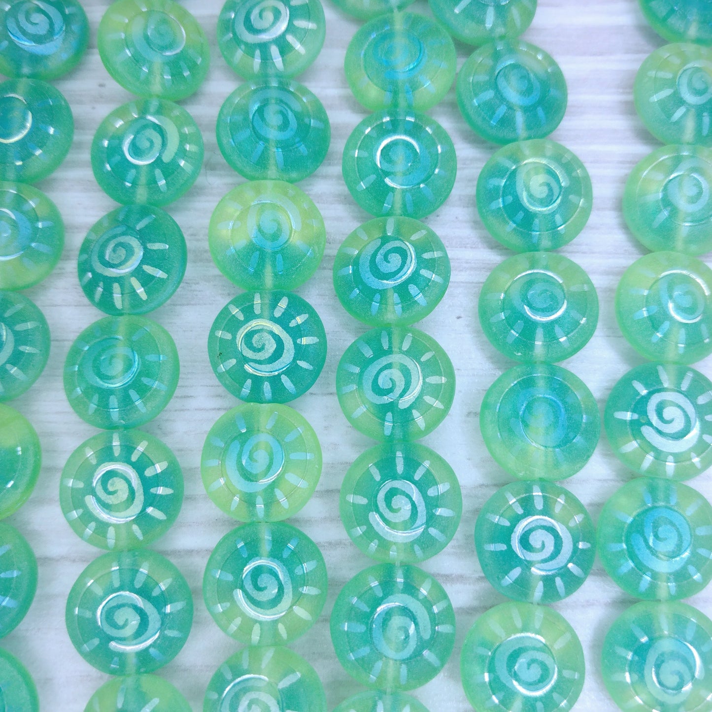 8 x 13mm beads in Green with laser etched Sun