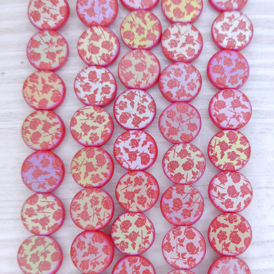 15 x 9mm disc beads in Matt Red with laser etched Flowers