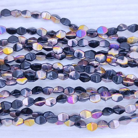 39 x Pinch beads in Black Sliperit (3x5mm)