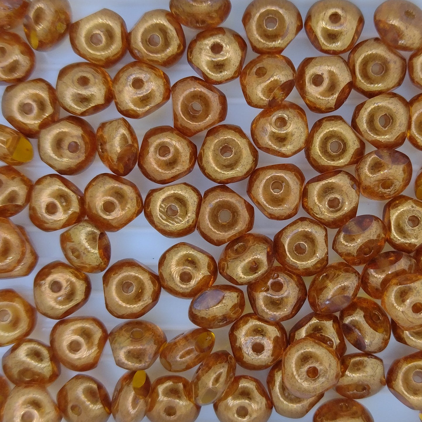 10 x tribeads in Amber with Bronze (4x7mm)