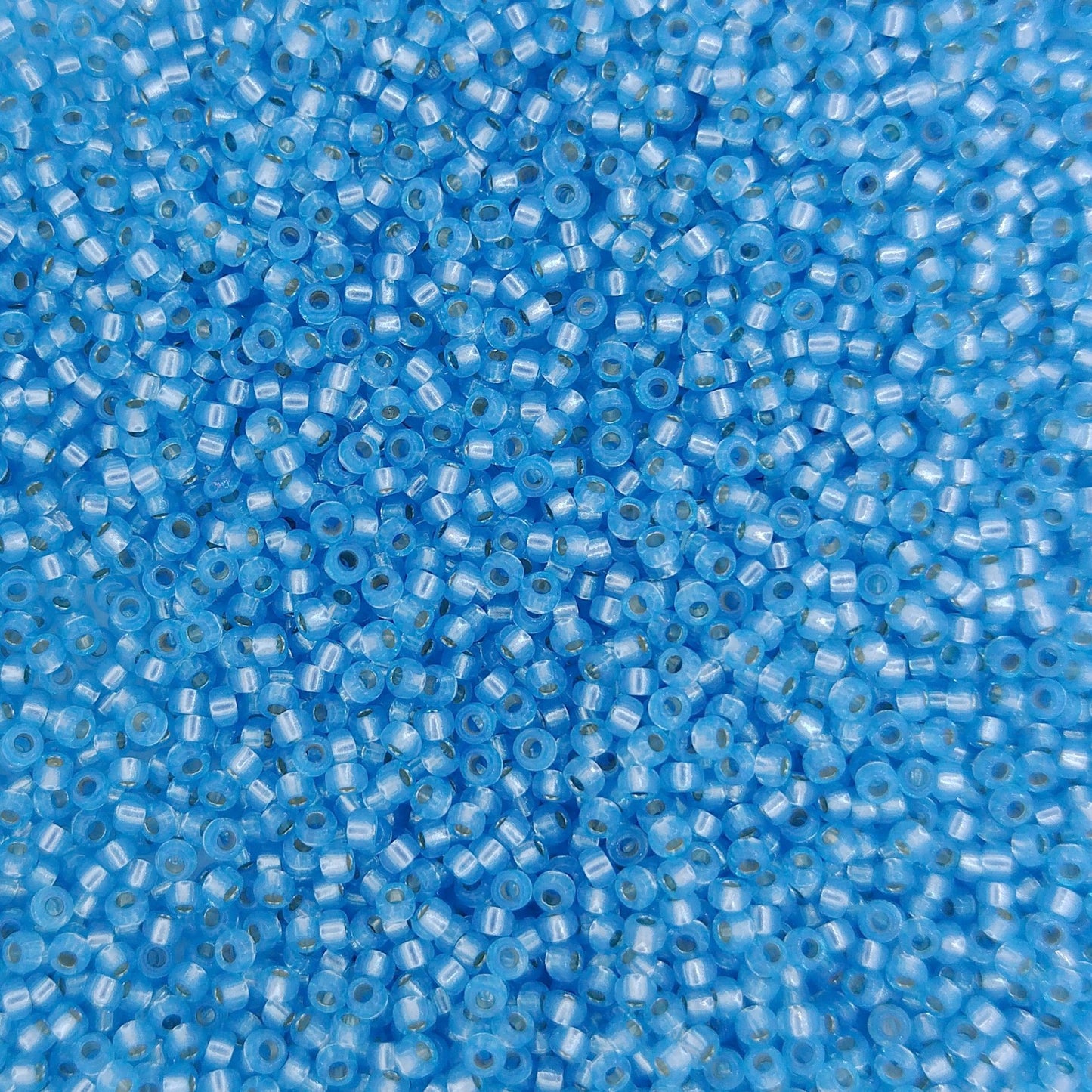 0573 - 25g Size 15/0 Miyuki seed beads in Silver lined Aqua