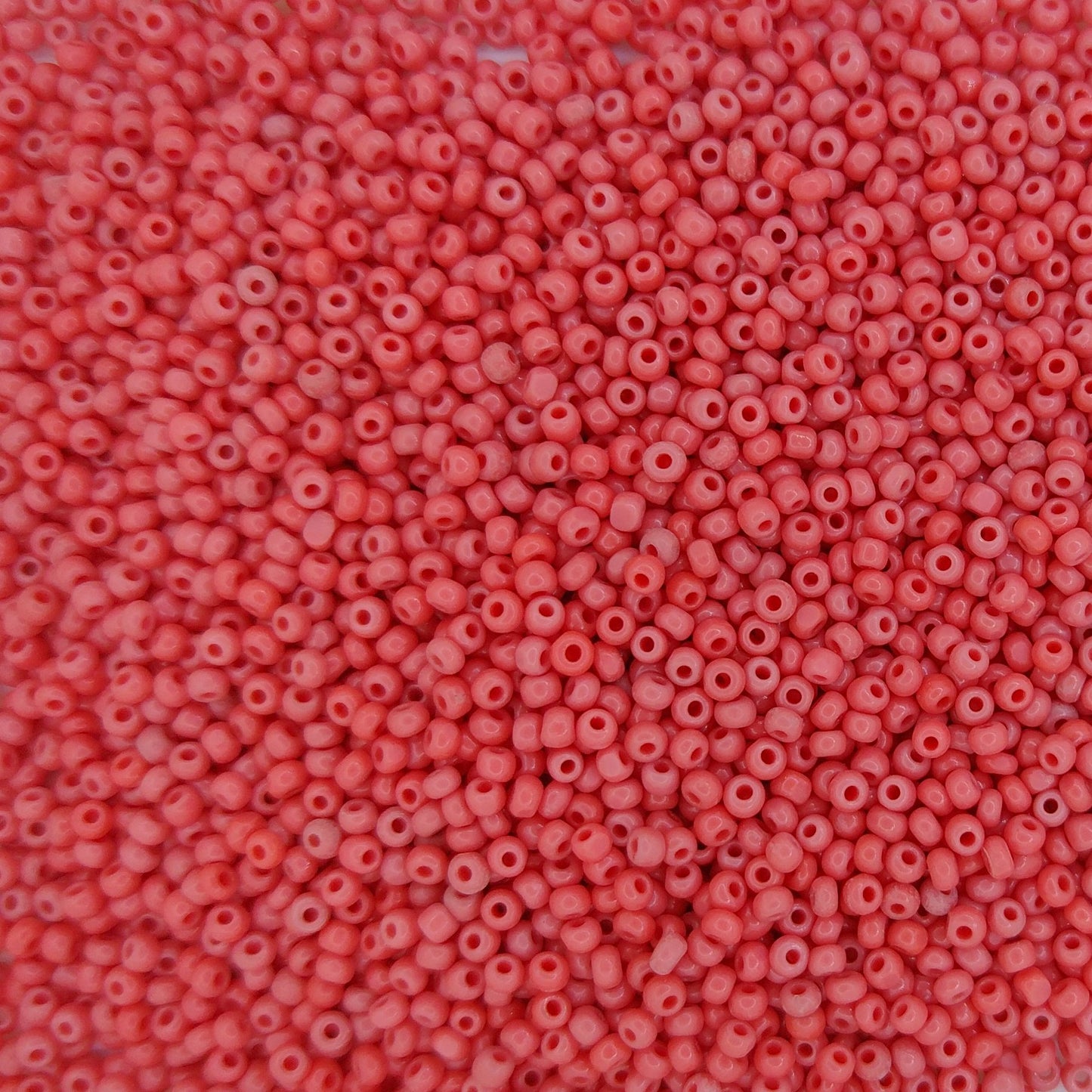 5g of Size 13/0 Czech charlottes in Opaque Coral Red *