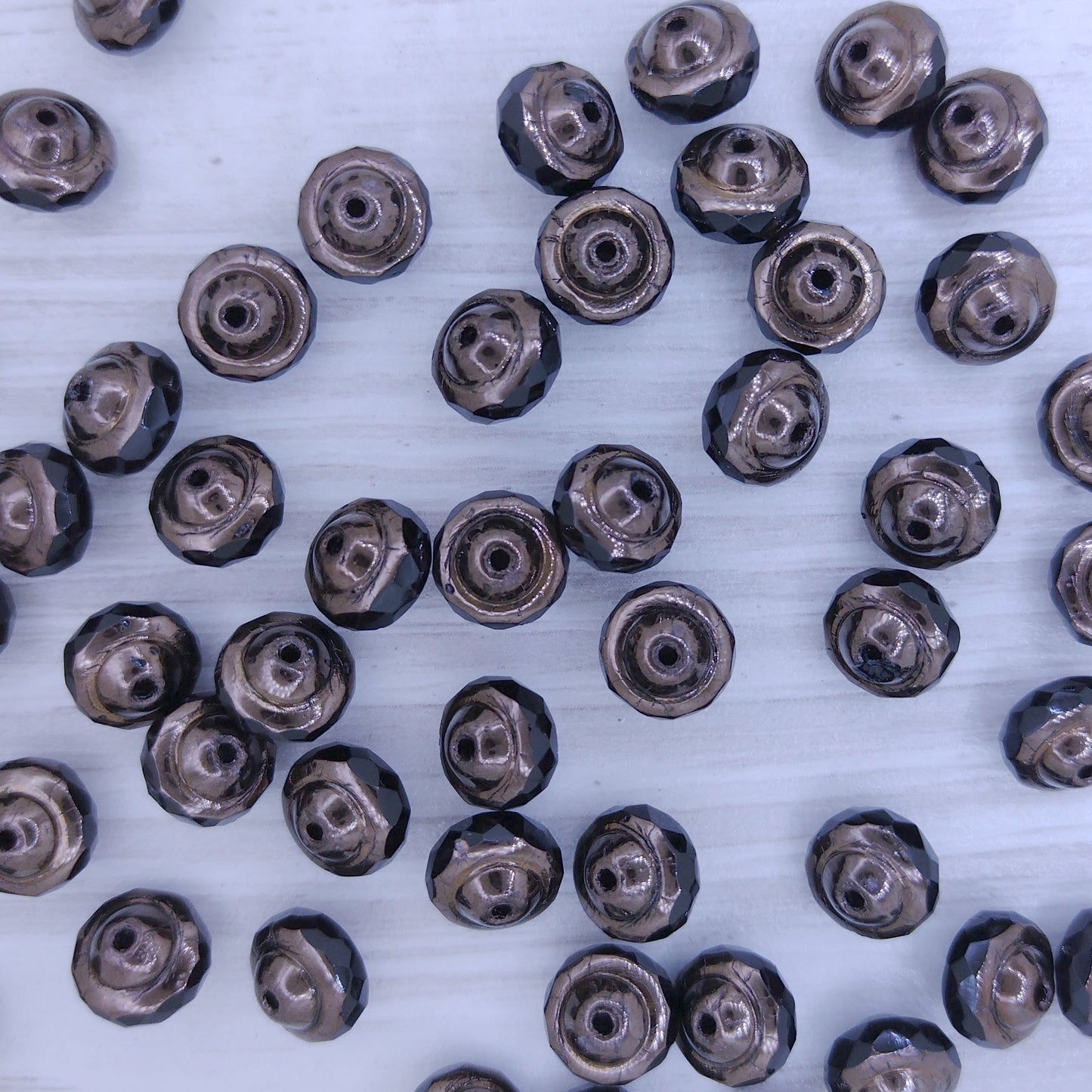 10 x Saturn beads in Black and Bronze (6x8mm)