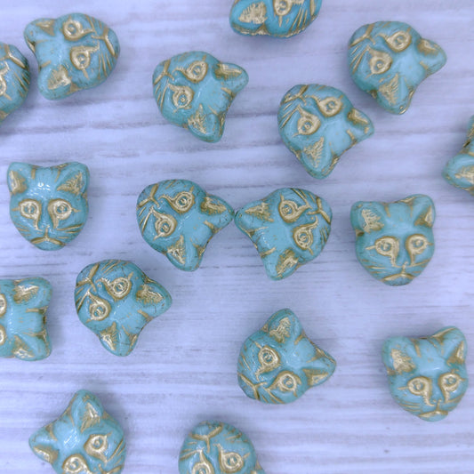 2 x 13mm Cat head beads in Light Turquoise with Gold