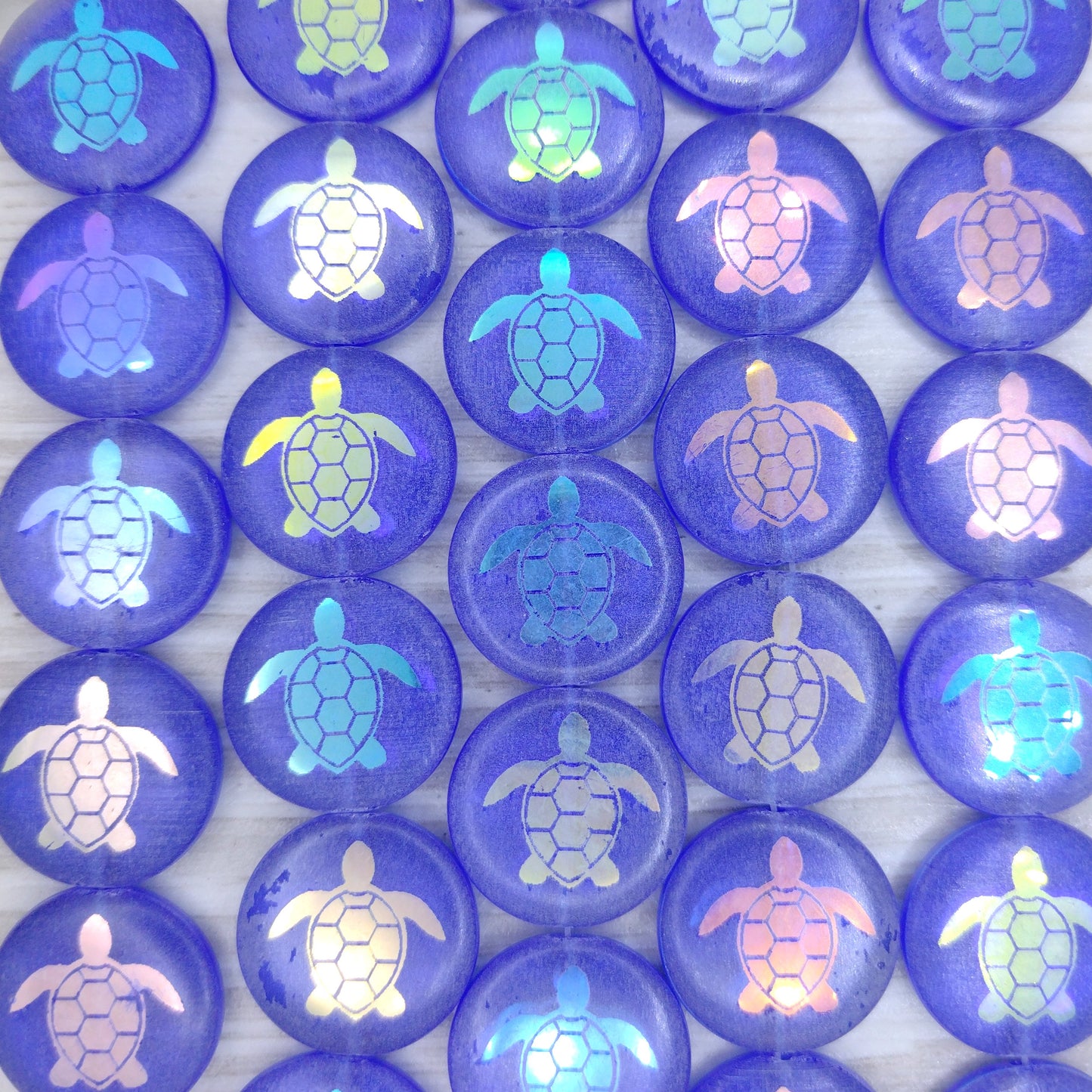 8 x 17mm disc beads in Dark Blue with laser etched Turtle